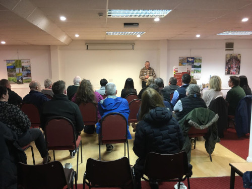 A room filled with Wotton's business owners.  A speaker at the front.